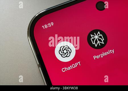 ChatGPT and Perplexity icons shown on bright red smartphone display. Stafford, United Kingdom, June 23, 2025 Stock Photo