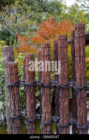 Closeup of fence made of rope and wooden pole in public park Stock ...