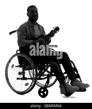 Silhouette of young man in wheelchair playing ukulele on white background Stock Photo