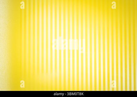 Alternate yellow and off-white bands are creating rhythmic flat design pattern with subtle gradient Stock Photo