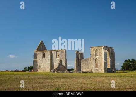 Ancient ruins of Abbaye des Chateliers monastery located in La Flotte, Ile de Re, Charente Maritime, France, under blue sky Stock Photo