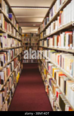 Various types of books arranged on shelf Stock Photo