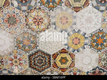 Intricate geometric tile pattern with vibrant colors and detailed designs. A close-up of a vibrant, colorful, and intricate geometric pattern of hexag Stock Photo