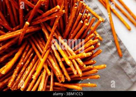 Organic Salty Pretzel Sticks in a Bowl, top view. Close-up. Stock Photo