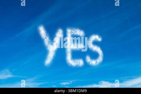 Yes written in white in sky Stock Photo