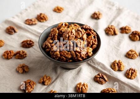 Raw Walnut Halfs in a Bowl, side view. Stock Photo