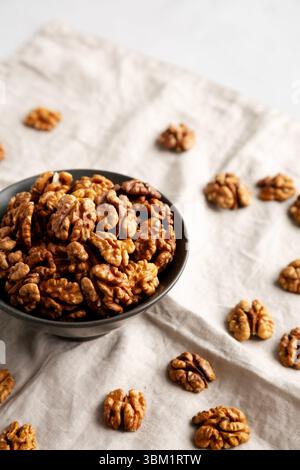 Raw Walnut Halfs in a Bowl, side view. Stock Photo