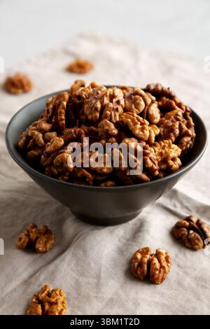Raw Walnut Halfs in a Bowl, side view. Stock Photo