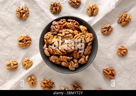 Raw Walnut Halfs in a Bowl, top view. Stock Photo