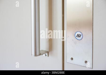 Elevator button on whte wall. Elevator Button up and down direction with copy space Stock Photo