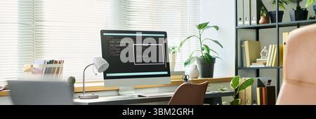 Modern Workspace Featuring Computer Screen Displaying Neural Network Coding Stock Photo