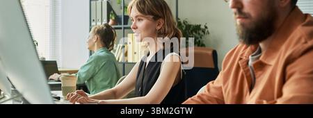 Young Adult Caucasian Woman Programming Neural Network Model with Team Members Stock Photo
