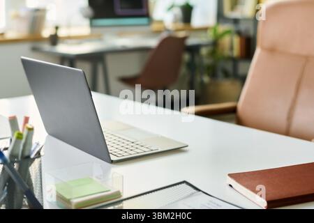 Modern Laptop on Desk in Office Stock Photo