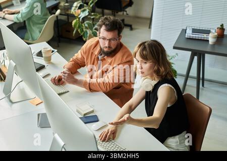 Colleagues Collaborating on Neural Network Development Stock Photo