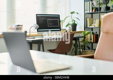 Modern Office Workspace Featuring Computer Developing Neural Network Code Stock Photo