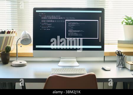 Closeup of Computer Monitor Displaying Neural Network Development Code Stock Photo