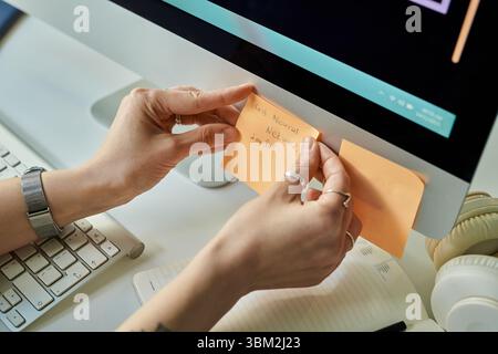 Caucasian Young Adult Woman Placing Sticky Note While Developing Neural Network Stock Photo