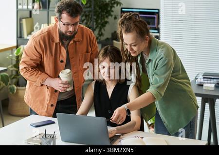 Woman Collaborating with Colleagues on Neural Network Development Stock Photo