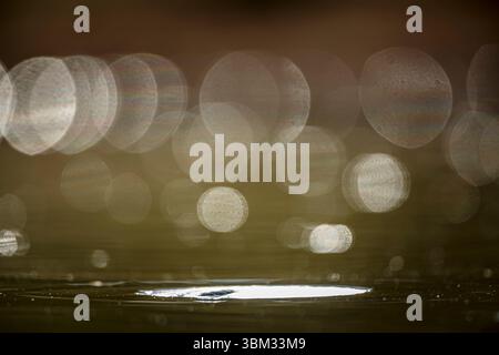 Spark light in water level for natural background Stock Photo