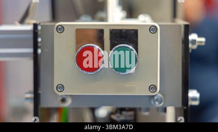 Red and Green Push Buttons Start Stop Control Box at Industrial Machine Stock Photo