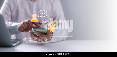 A business professional using a smartphone with chatbot AI and messaging interface icons, illustrating digital communication, virtual assistant servic Stock Photo
