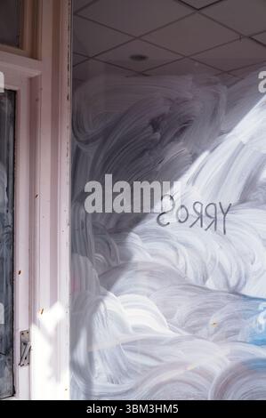 Sorry written backwards wrongly on a shop window in Brighton Stock Photo