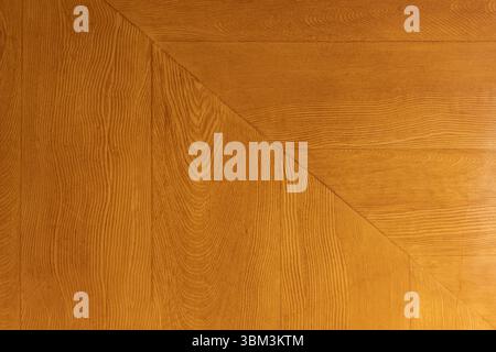 Image displaying a close-up view of a wooden panel surface showcasing unique angular designs. Background photo texture Stock Photo