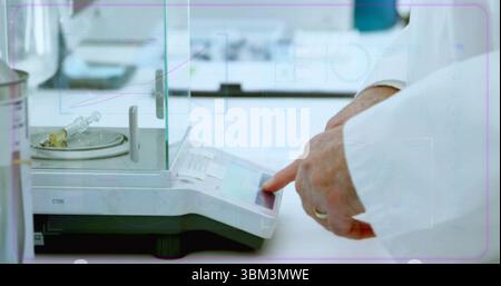 Operating scientist hands in lab coat entering data on analytical scale at lab, syringe, copy space Stock Photo