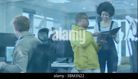 Discussing project team members gathering behind dotted glass in open-plan office with black binder Stock Photo