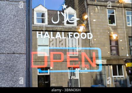 Halal Food and Open sign in a restaurant window, UK, Scotland, Europe Stock Photo