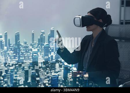 Building information modelling. Woman using virtual reality headset in office. holographic projection of city Stock Photo