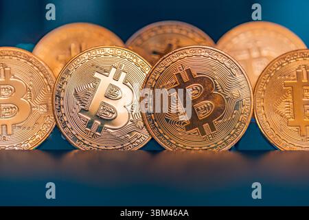 Abstract closeup of Bitcoin gold coins, soft light reflections, cryptocurrency concept, digital finance background, financial investment technology Stock Photo