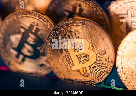 Abstract closeup of Bitcoin gold coins, soft light reflections, cryptocurrency concept, digital finance background, financial investment technology Stock Photo