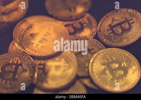 Abstract closeup of Bitcoin gold coins, soft light reflections, cryptocurrency concept, digital finance background, financial investment technology Stock Photo
