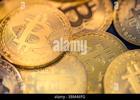 Abstract closeup of Bitcoin gold coins, soft light reflections, cryptocurrency concept, digital finance background, financial investment technology Stock Photo