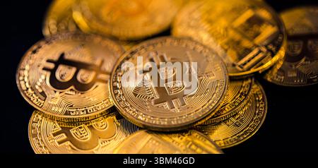 Abstract closeup of Bitcoin gold coins, soft light reflections, cryptocurrency concept, digital finance background, financial investment technology Stock Photo