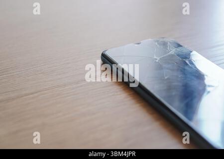 Close-up of broken cell phone screen, copy space Stock Photo