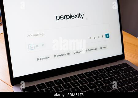 Perplexity AI search interface on laptop showing query bar and category icons. Stafford, United Kingdom, June 24, 2025 Stock Photo