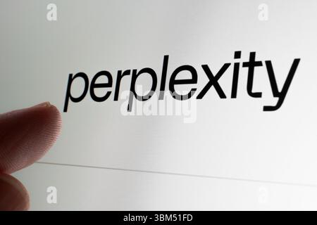 Perplexity name shown close-up on screen with user finger pointing toward it. Stafford, United Kingdom, June 24, 2025 Stock Photo