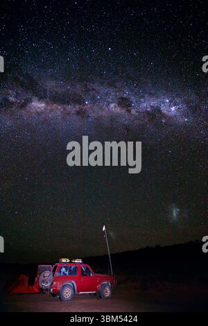 Camp, night sky and milky way, Simpson Desert, Queensland, Australia. (Editorial Use Only) Stock Photo