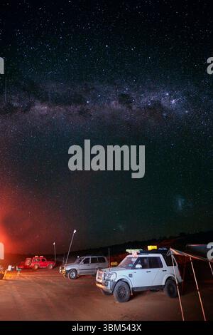 Camp, night sky and milky way, Simpson Desert, Queensland, Australia. (Editorial Use Only) Stock Photo