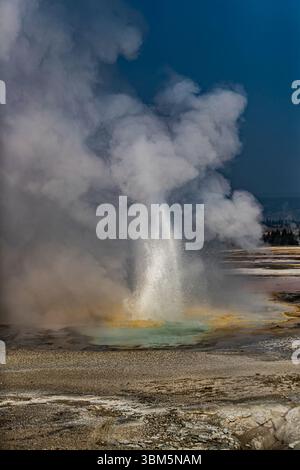 Geysers spew boiling water and steam into the air. Stock Photo