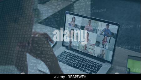 Showing laptop displaying nine-person team meeting in office with smartphone and code overlay. Collaboration, technology, communication, teamwork, inn Stock Photo