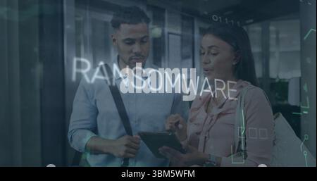 Analyzing professionals viewing digital tablet in office space, with ransomware overlay graphics. Cybersecurity, innovation, technology, collaboration Stock Photo