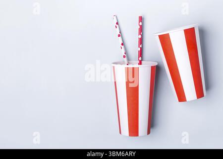 Two Empty striped paper cup on a blue background Stock Photo