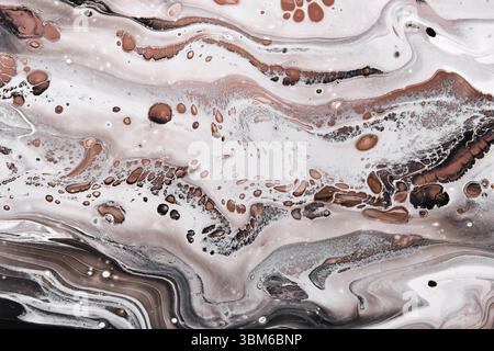 Acrylic Fluid Art. Brown and black waves and stains. Abstract marble agate stone background or texture Stock Photo