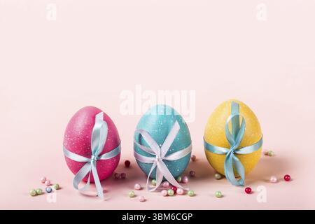 Three decorated eggs are in a row. Easter concept Stock Photo
