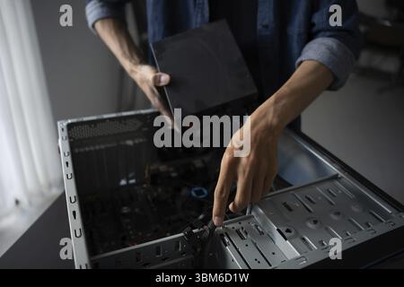 IT Engineer installing Hardware Equipment Development Facility Engineer Maintenance computer Motherboard Electronic repair shop technology business Stock Photo