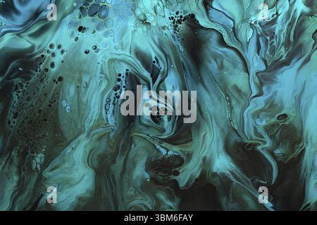Fluid Art. Green and blue abstract wave swirls on black background. Marble effect background or texture Stock Photo