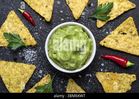 Guacamole and Corn Chips close-up. Traditional Latin American Food Stock Photo